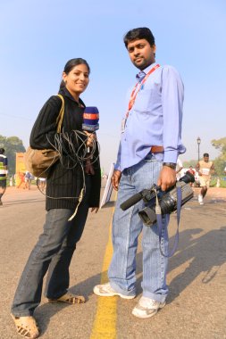 Two reporters at marathon clipart