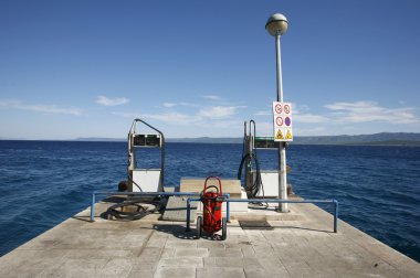 :Petrol fuelling station on mediterranean seaside, croatia clipart