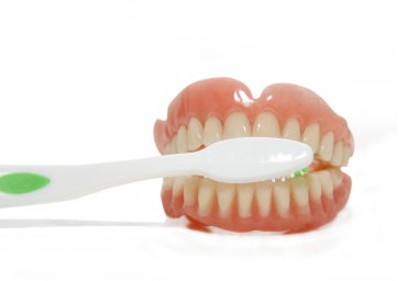 False teeth and toothbrush clipart