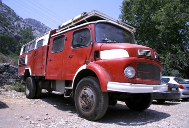 Red fire truck converted into a campervan clipart