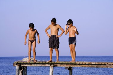 Boys on pier clipart