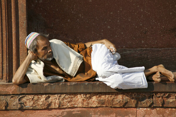 Old man relaxing at Jama Masjid, Delhi, India
