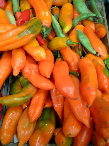 stock image Orange chilis in market, lima, peru