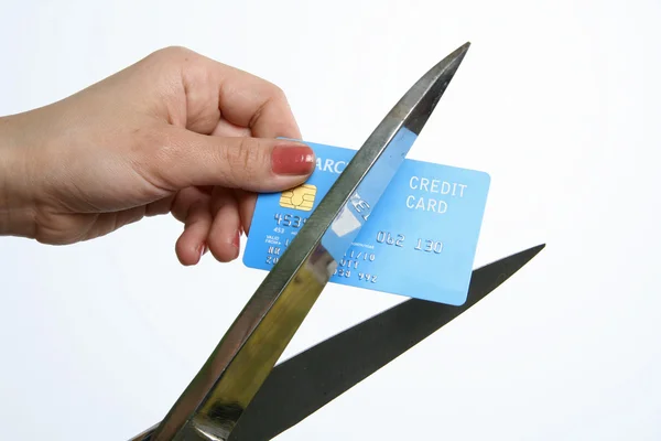 stock image Cutting up credit card with scissors