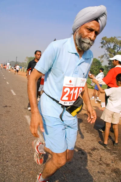 Elderly male marathon runner — Stock Photo, Image