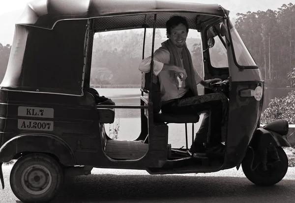 Caucasian man at the wheel, south india — Stock Photo, Image