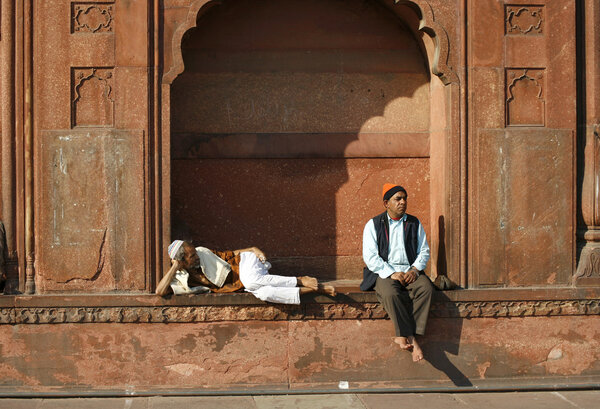 Two old men relaxing at Jama Masjid, Delhi, India