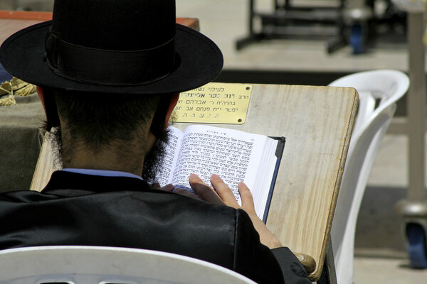 Hasidic jews at the wailing western wall, jerusalem, israel