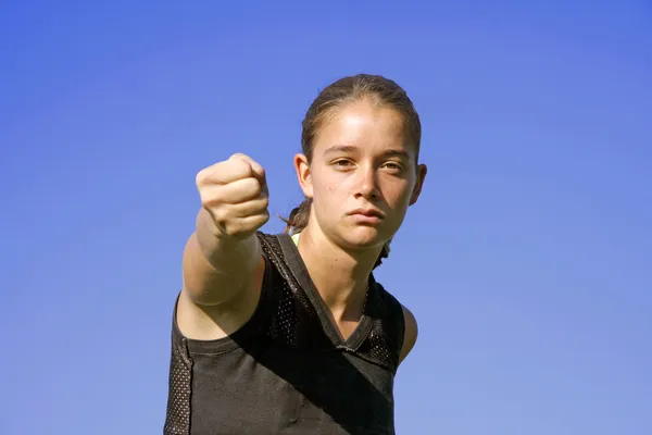 Attractive young woman practising self defense