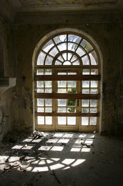 Door window entrance in an abandoned hotel after the war in Croatia