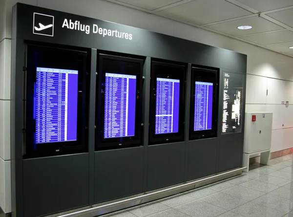 Departure display panel at airport — Stock Photo, Image