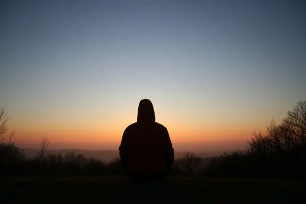 Silhouette of meditating person — Stock Photo, Image
