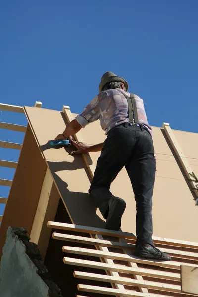 帽子の屋根葺き職人 — ストック写真