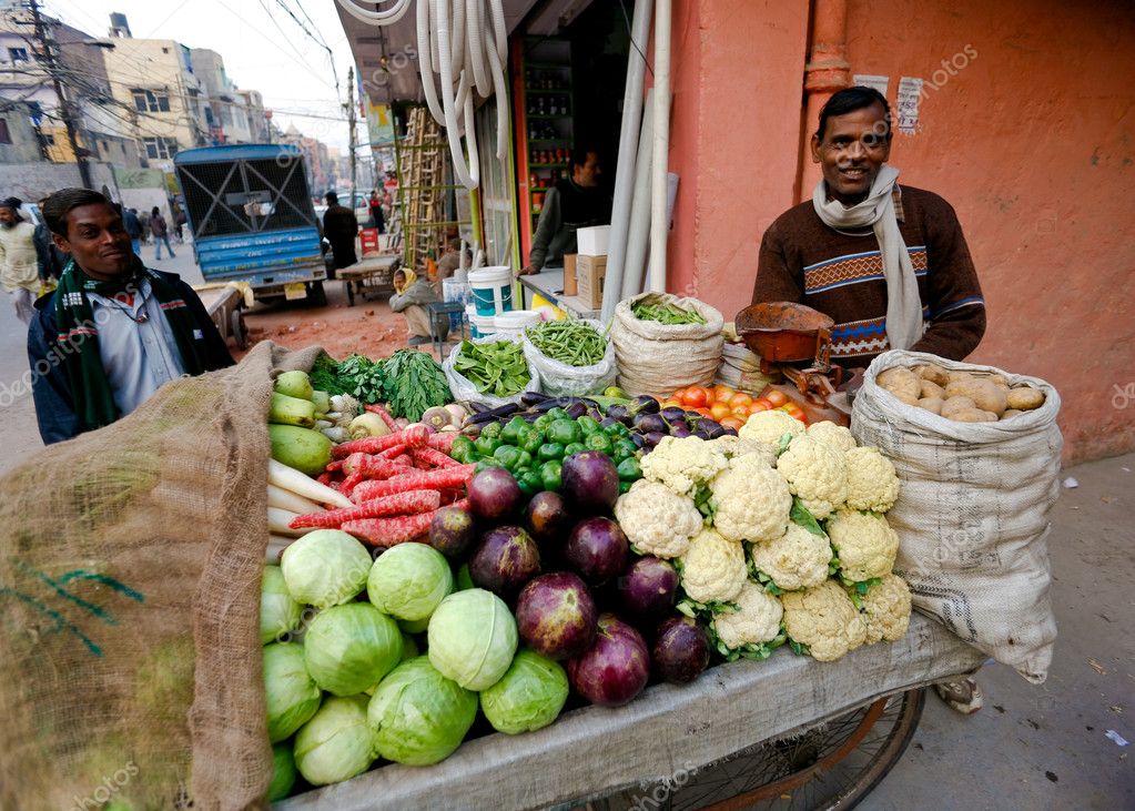 Vendor selling bags in a street market, New Delhi, India Stock