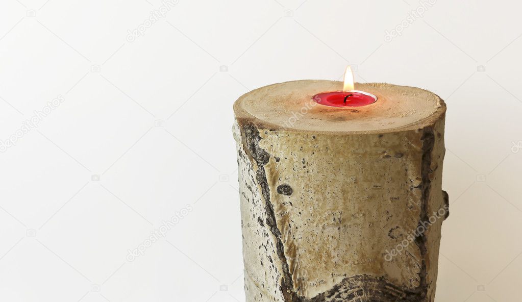 A Candle Fashioned from a Log of Aspen