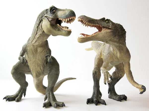 Ein Tyrannosaurus rex Dinosaurier kämpft gegen einen Spinosaurus — Stockfoto