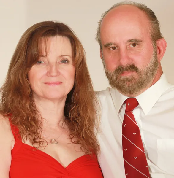 A Middle Aged Married Couple in Red