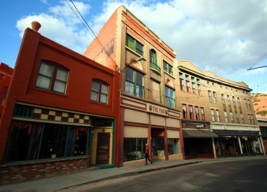 A Woman Walking on a Street in Bisbee clipart