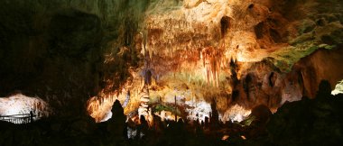 A Woman Marvels at Carlsbad Caverns National Park clipart