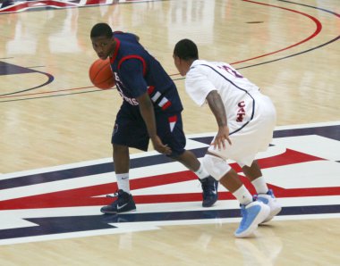 Anthony Myers defended by Lamont Jones in an Arizona Basketball Game clipart