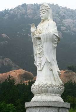 A Guanyin Colossus in Lao Shan, China clipart