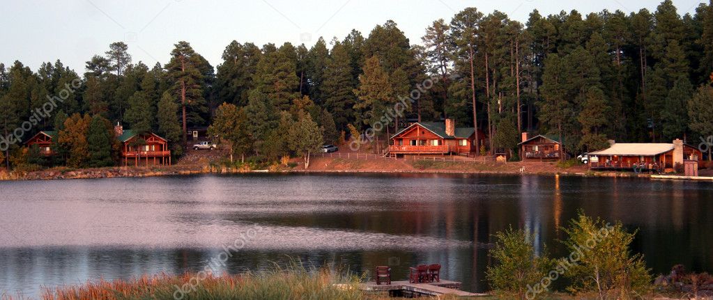 As Twilight Blankets the Cabins on a Mountain Lake