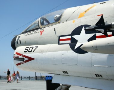 A Tourist Family and an A-7 Corsair II clipart