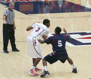 A Ref Whistles a Foul in an Arizona Basketball Game clipart