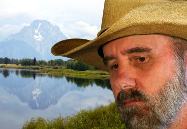 A Sad Cowboy and Mount Moran in the Tetons clipart