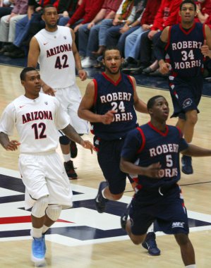 A Race Down Court in an Arizona Basketball Game clipart