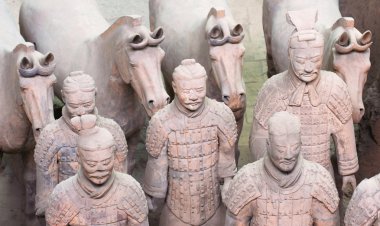 A Group of Five Terracotta Army Soldiers and Four Horses clipart