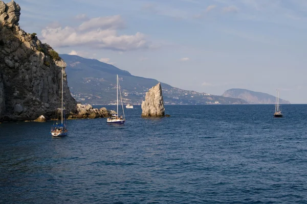 stock image Sailing vessels and rock