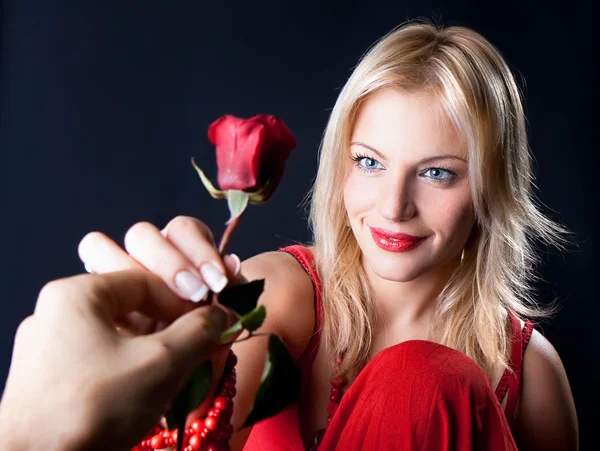 Beautiful Woman holding red rose. — Stock Photo, Image