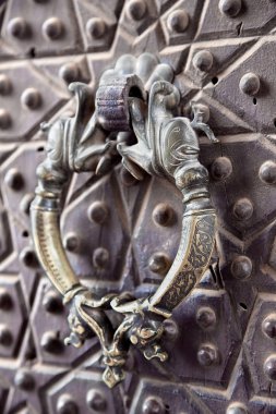 Door handle on a Agha Bozorg mosque, Kashan, Iran clipart