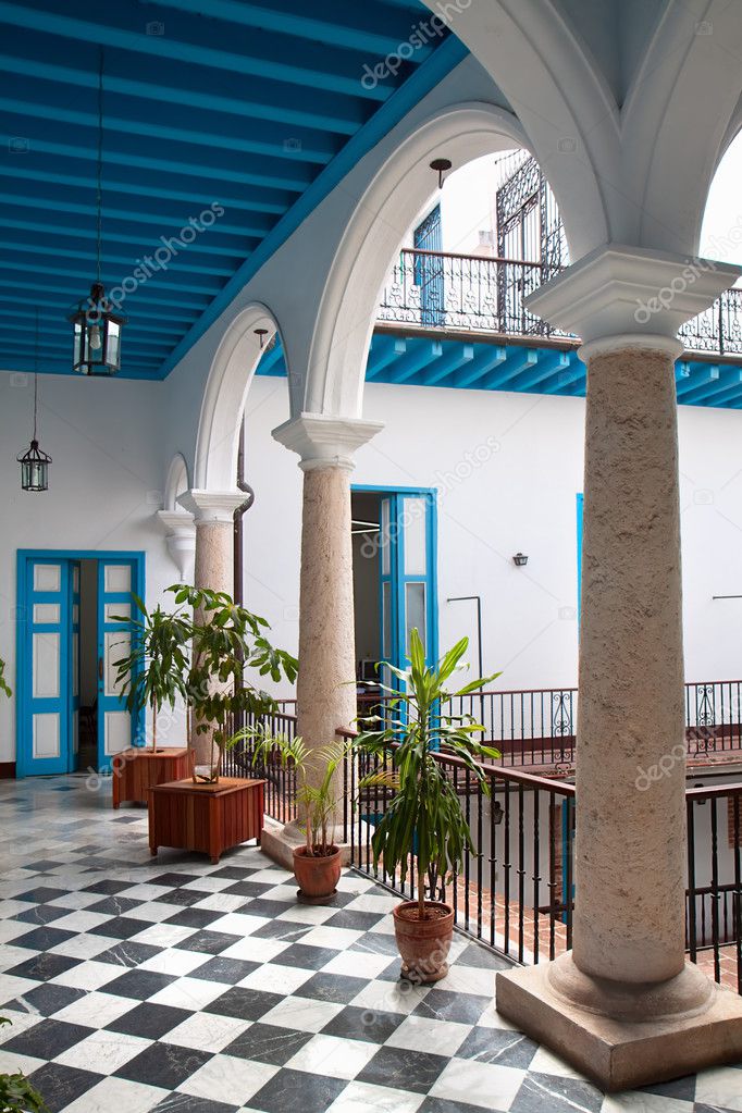 A view of colonial building interior with tropical flowers, Cuba