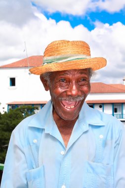 Old cuban man with straw hat make a funny face clipart