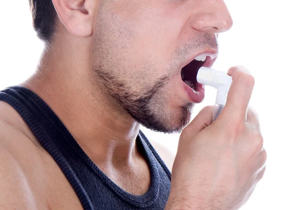 Close up look of a man with pump in his mouth — Stock Photo, Image