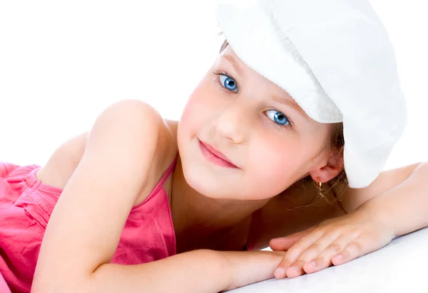 Cute little girl with white cap posing — Stock Photo, Image