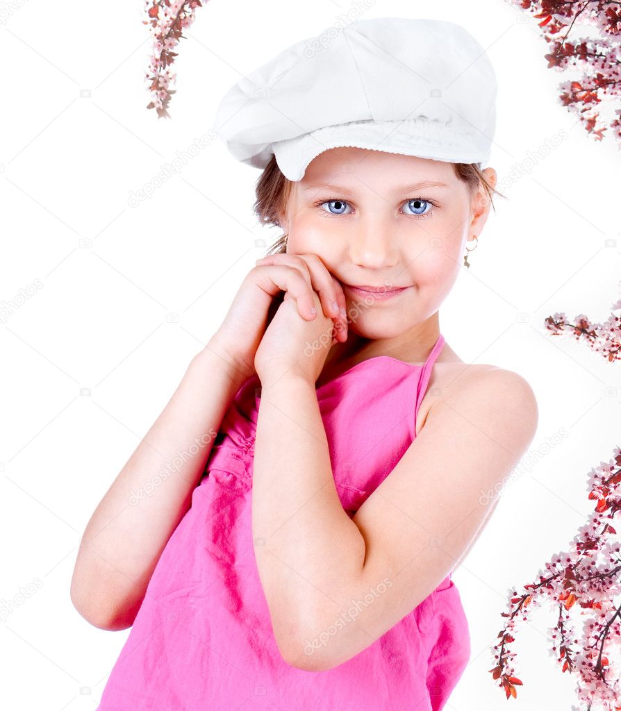 Cute little girl with white cap posing