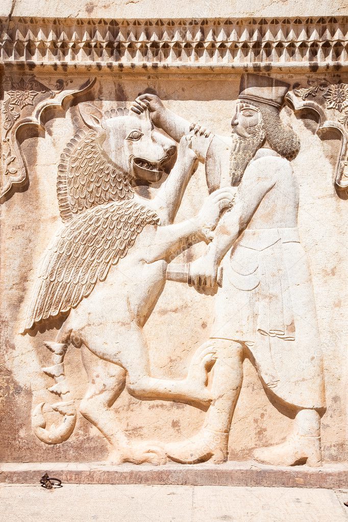 Persian soldier bas-relief killing a bist, stone statue in Shiraz