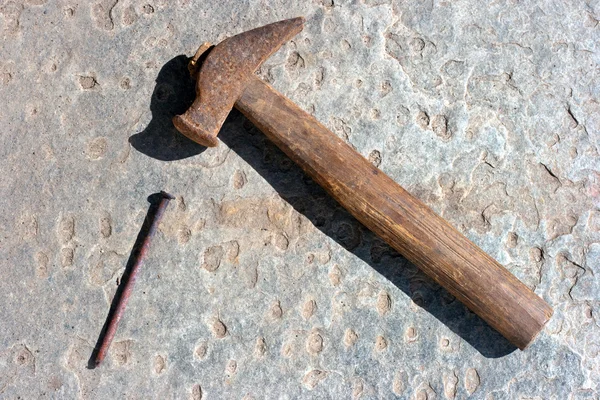 Old hammer and nail — Stock Photo, Image