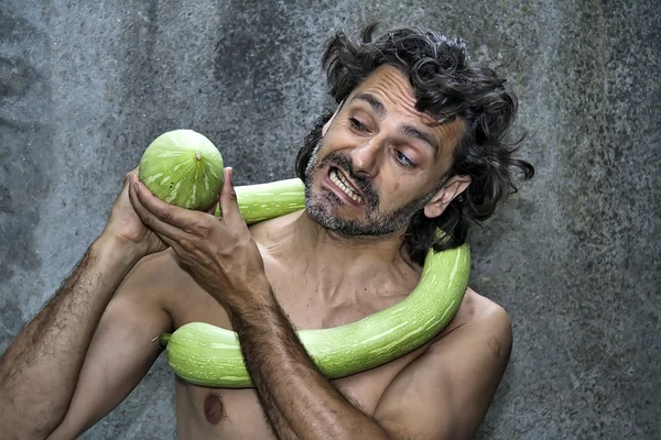 Fighting with a giant zucchini — Stock Photo, Image
