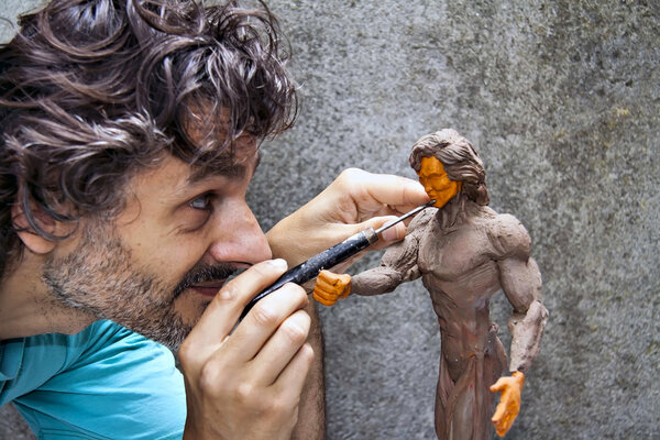 Sculptor working detail