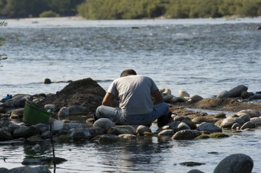 Gold prospecting in the Ticino River clipart