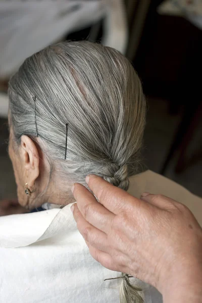 Elderly woman with hairstylist — Stock Photo, Image