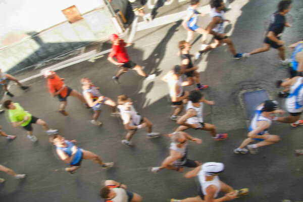 Runners partecipating in a walking race, motion blur photo