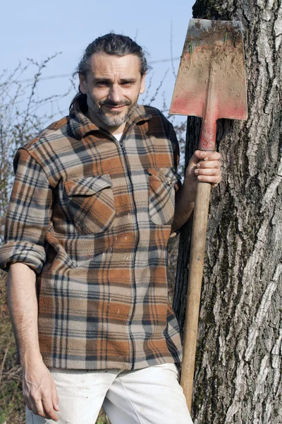 Man with spade — Stok fotoğraf