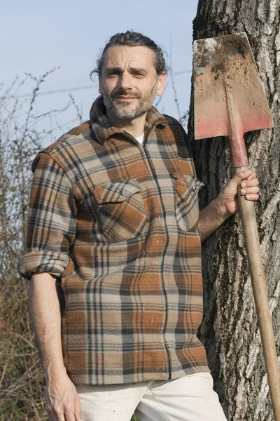 Man with spade — Stok fotoğraf