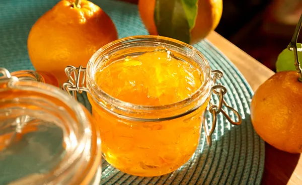 Jar of homemade orange preserves — Stock Photo, Image