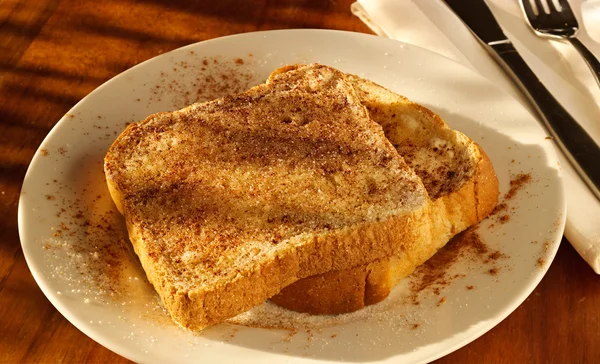 Cinnamon sugar toast in golden light — Stock Photo, Image